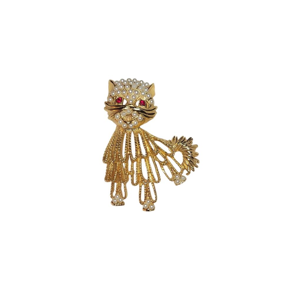 Vintage gold-tone cat brooch with red rhinestone eyes and white beaded accents